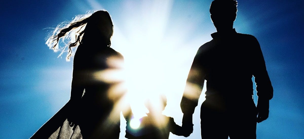 man and woman holding hands