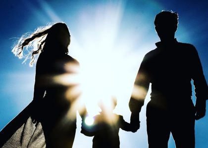 man and woman holding hands